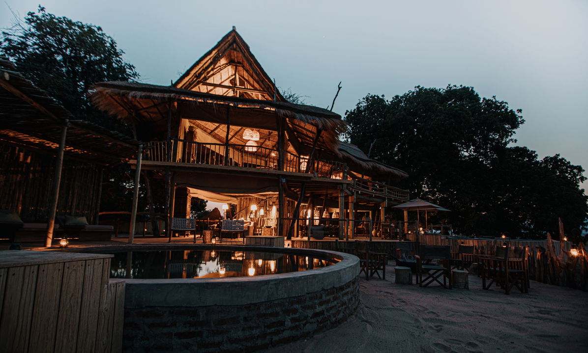 view of lodge at night from fireplace of Nyamatusi Camps Mana Pools Zimbabwe 