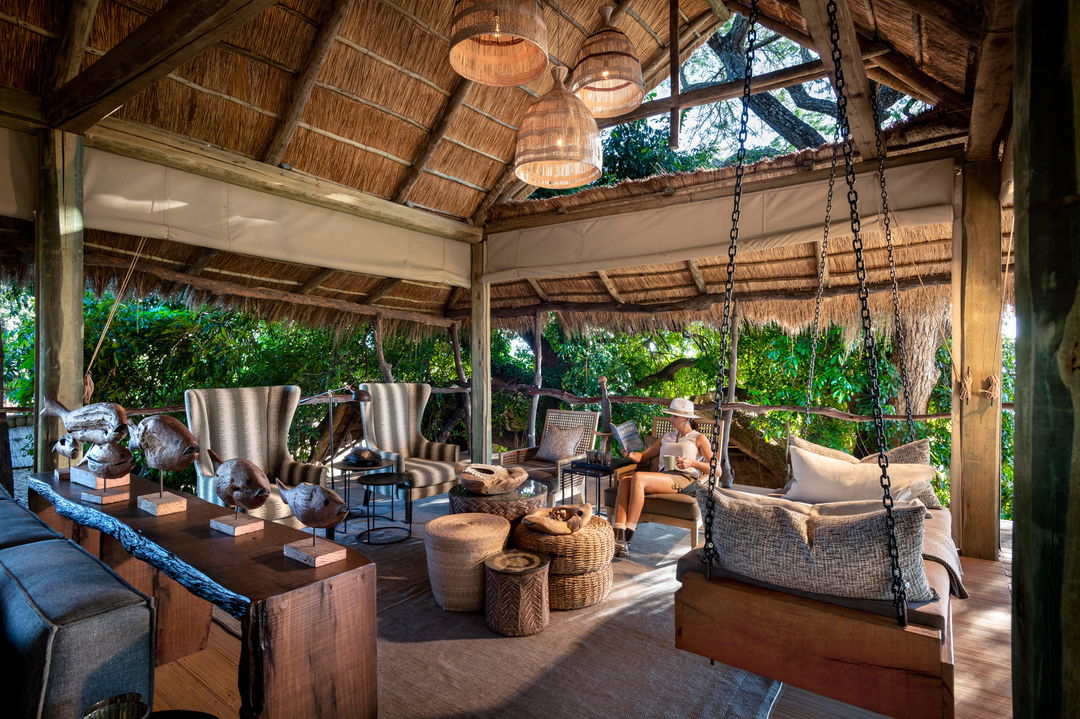 lady reading in lounge of Nyamatusi Camps Mana Pools Zimbabwe 