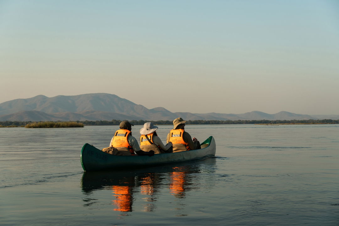 guests on the Zambezi in a canoe near Nyamatusi camps mana pools