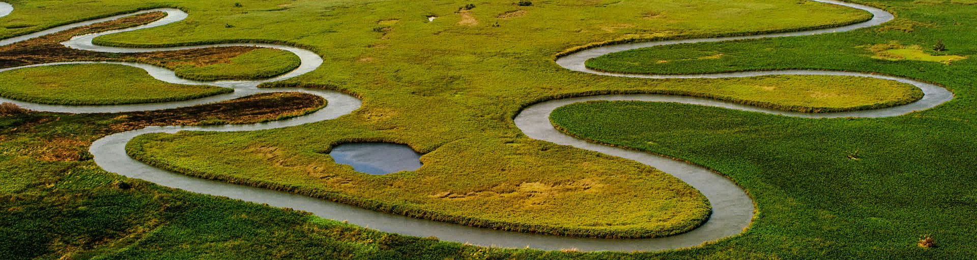  airial view of river snaking through okavango delta botswana waterways