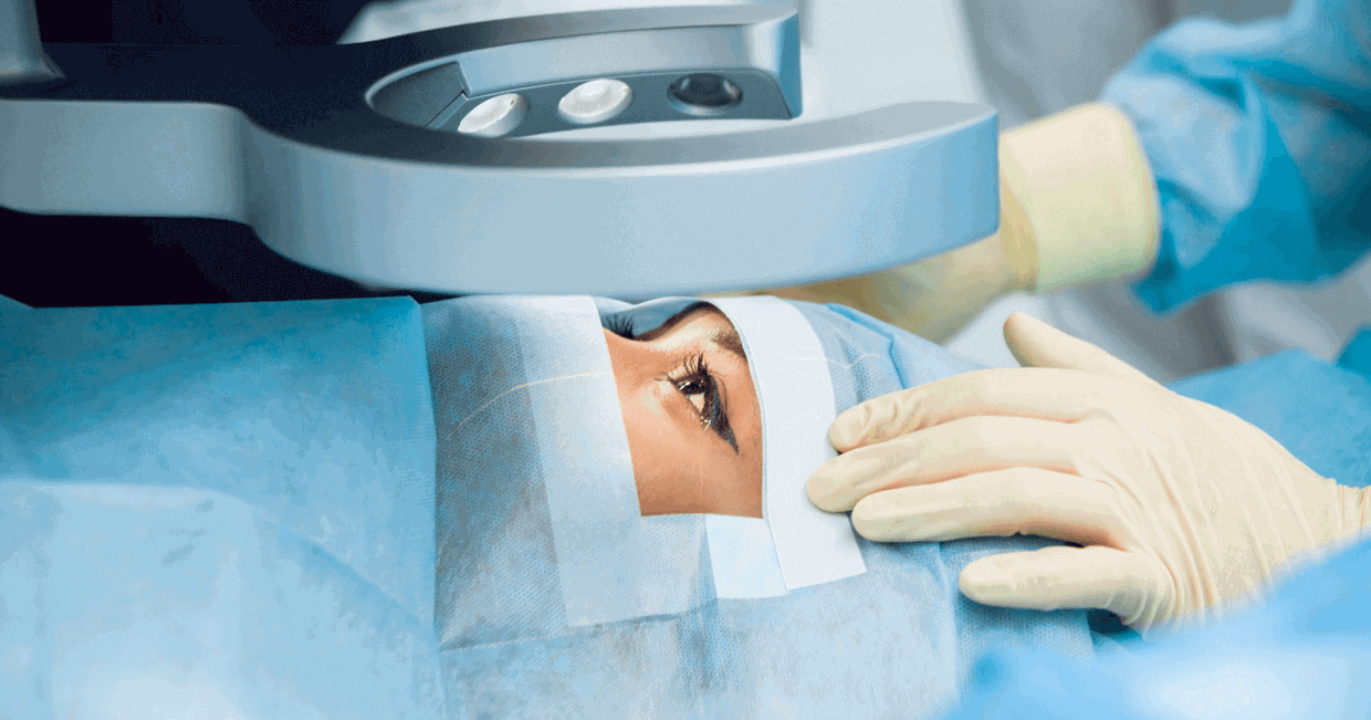 eye surgery on lady looking at microscope
