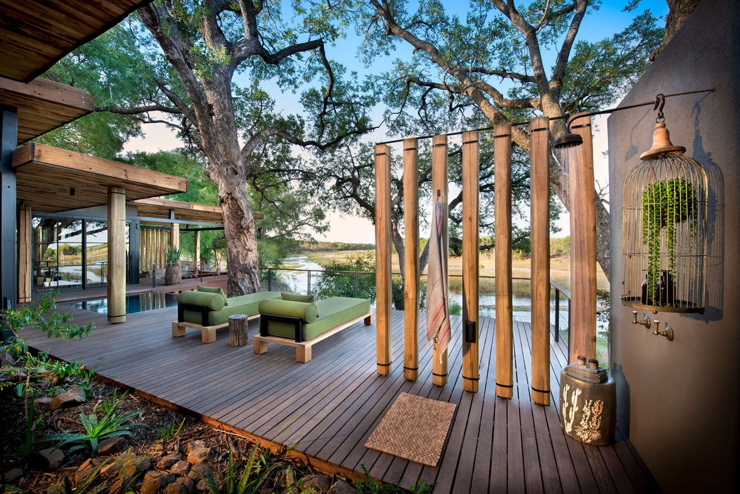 outside pool deck with loungers by room at &Beyond Tengile River Lodge Sabi Sands