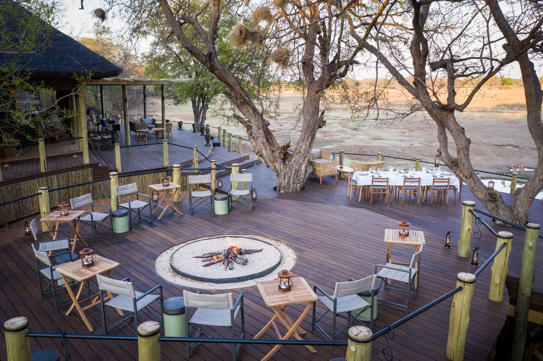 viewing deck with tables ready for breakfast of main lodge puku ridge zambia