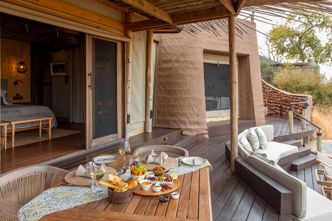 deck with table and food at Puku Ridge Camp Zambia Luangwa Plains