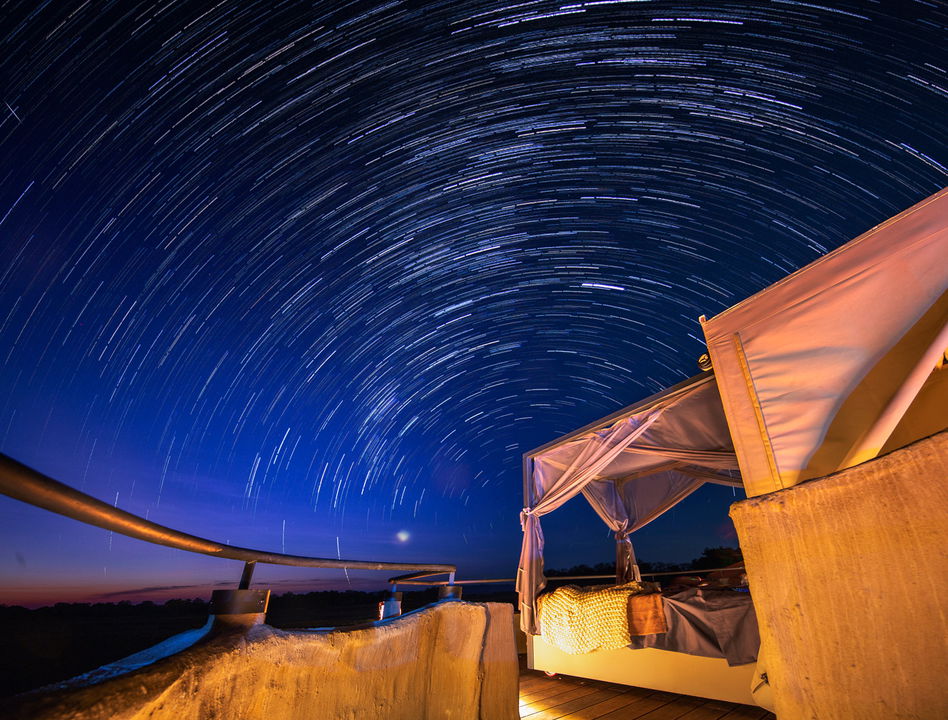 star trail viewed from starbed at night by Puku Ridge Camp Zambia