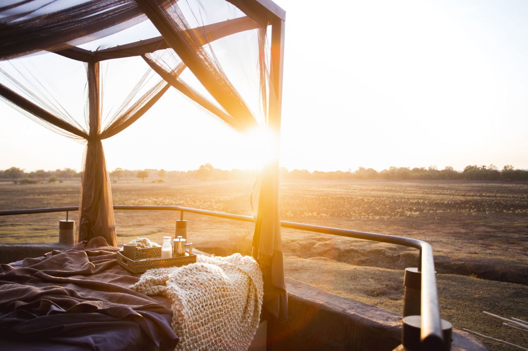 morning view of plains from starbed of a suite at Puku Ridge Camp Zambia Luangwa Plains