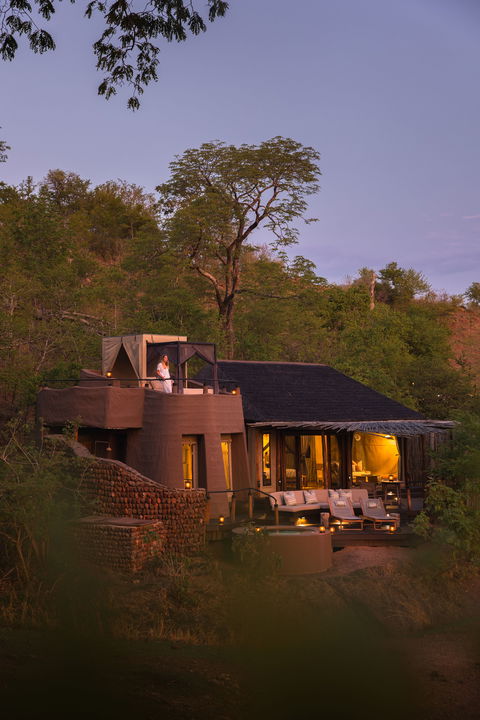 evening view of a suite exterior at Puku Ridge Camp Zambia Luangwa Plains