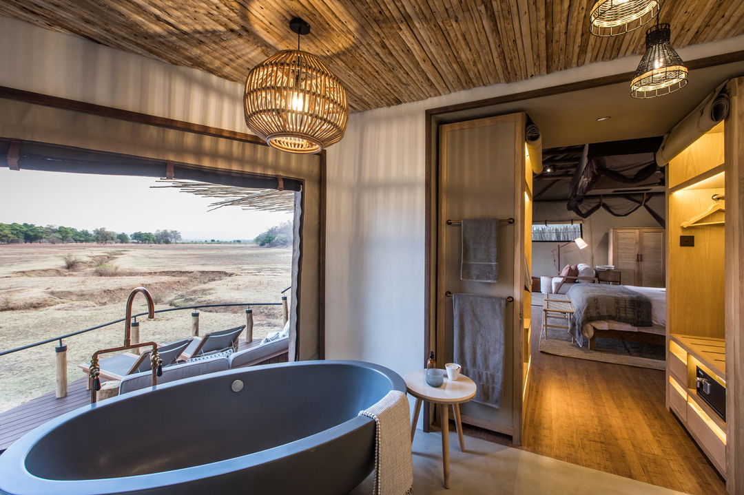 bathroom overlooking plains by Puku Ridge Camp Zambia
