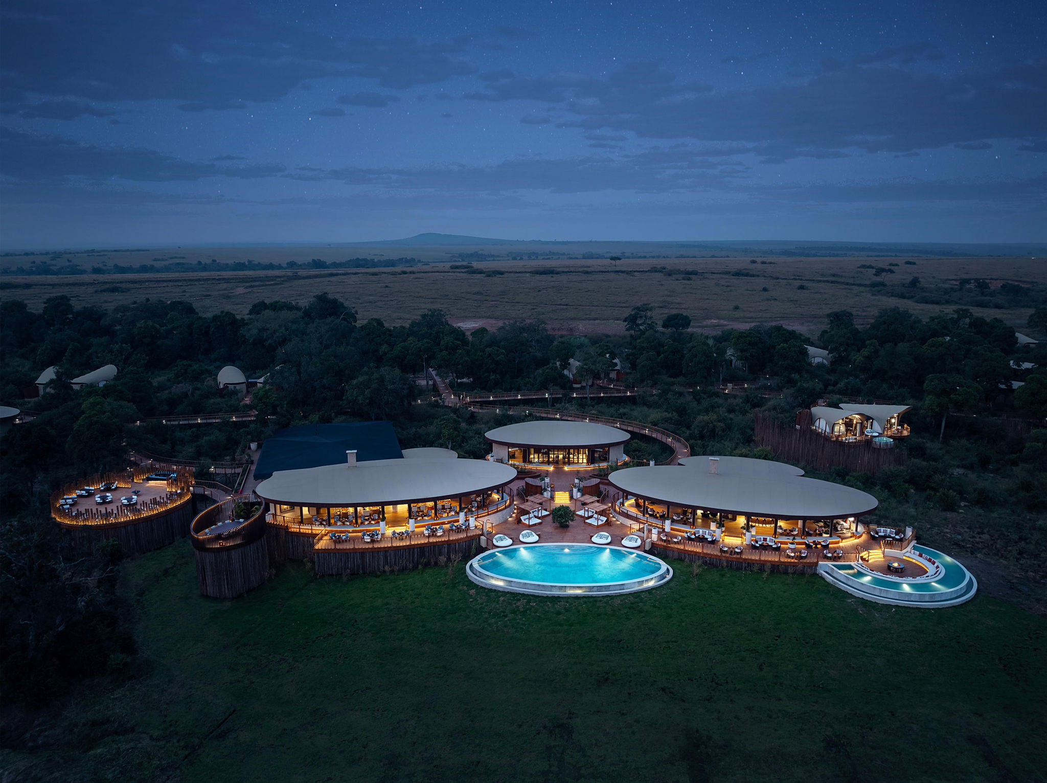 evening aerial view of main lodge at ritz carlton masai mara