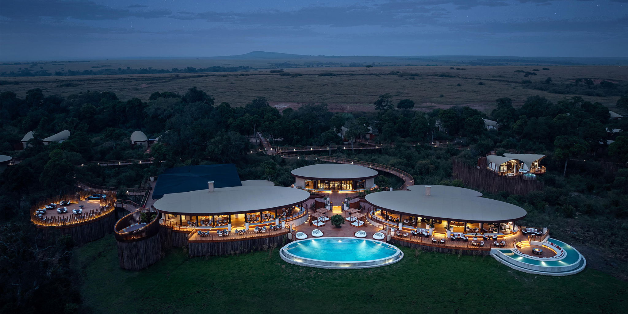 evening aerial view of main lodge at ritz carlton masai mara
