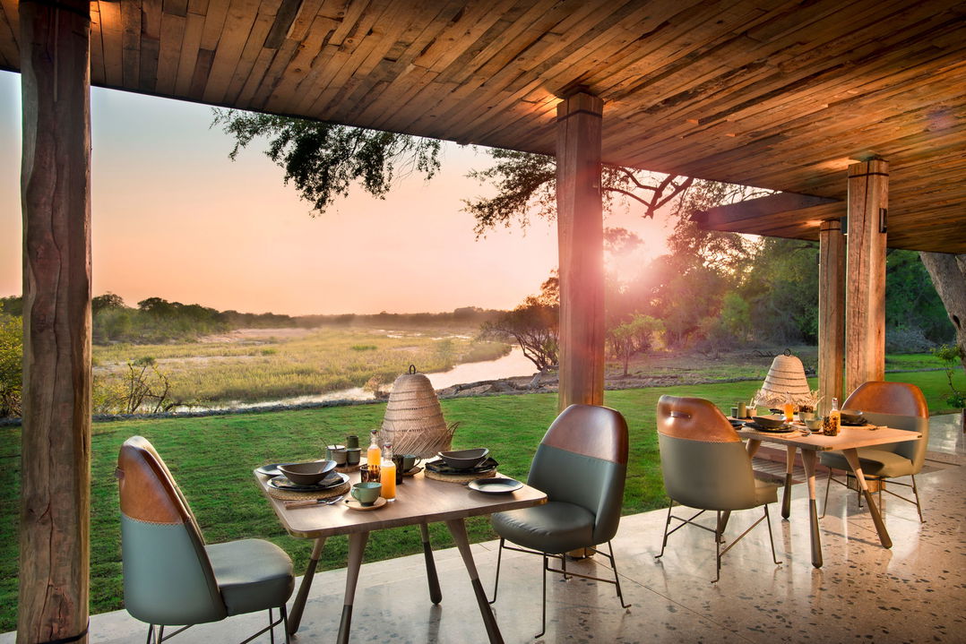 table set for breakfast with river view at &Beyond Tengile River Lodge Sabi Sands