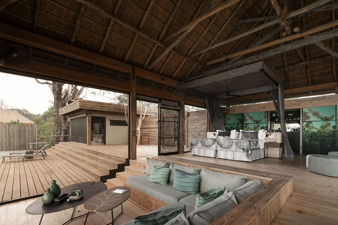 sunken couches on main deck of Vumbura Plains Camp Wilderness Okavango Delta