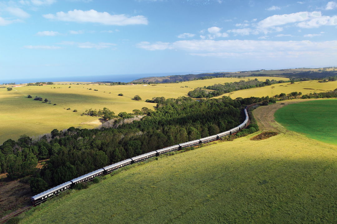 train ariel view going through greenhills countryside of South Africa with Rovos rail luxury train safaris