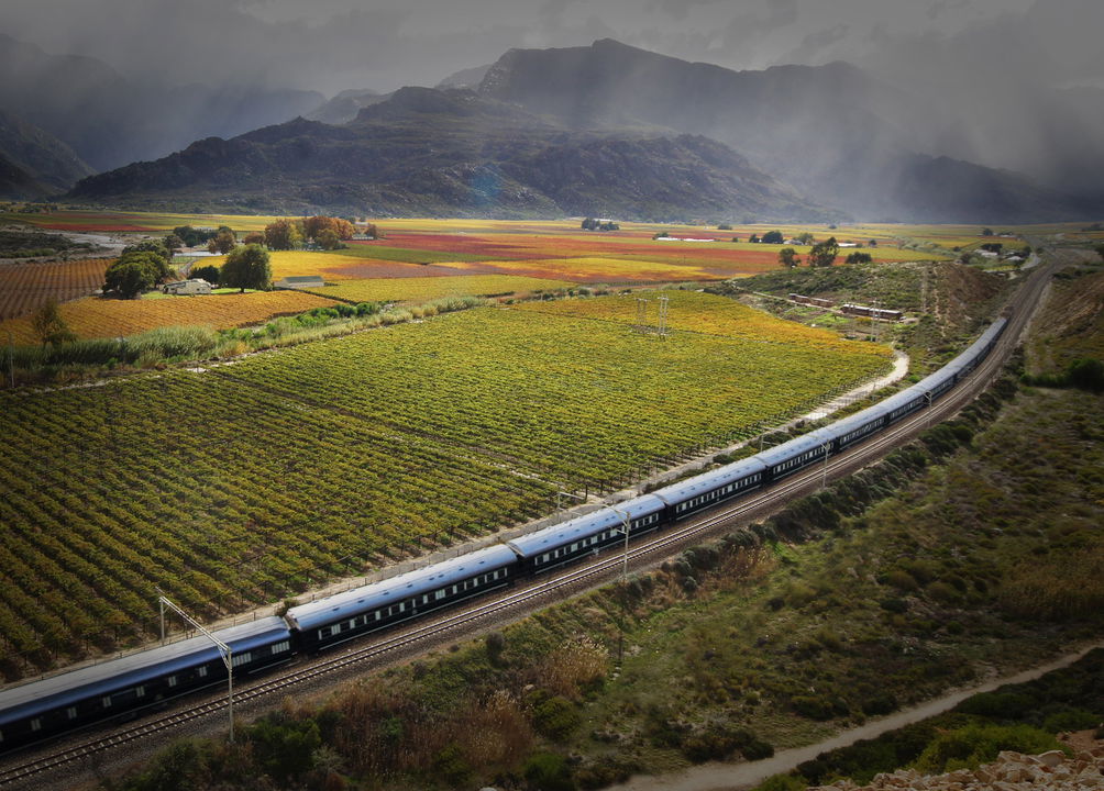 aerial view of Rovos rail luxury train crossing Hexrivier mountains 