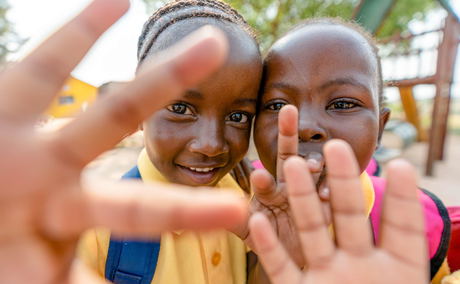 two kids filmed on a community outreach of royal malewane lodges