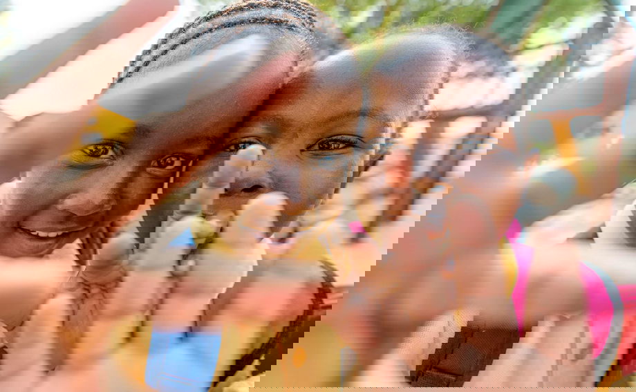 two kids filmed on a community outreach of royal malewane lodges