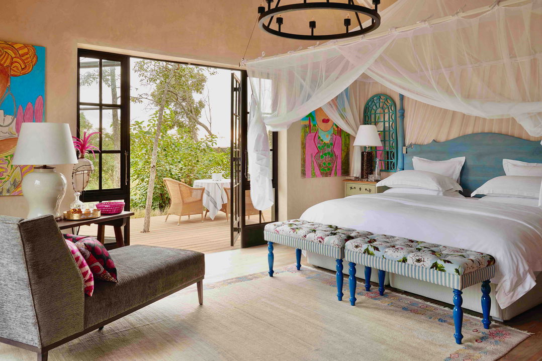 bedroom and deck view of farmhouse suite of royal malewane farmhouse