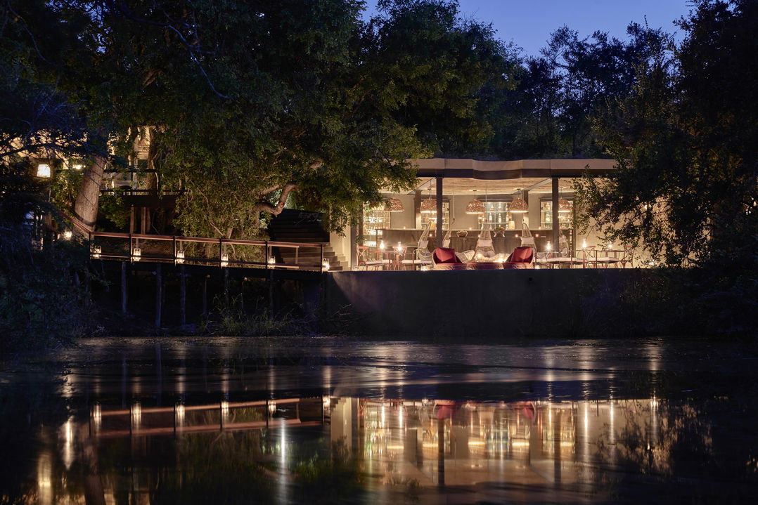 view of royal malewane lodge at night form the dam 