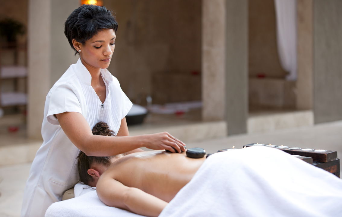 lady on message table getting treatment at bush spa of royal malewane lodge