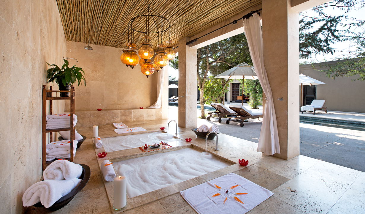 view of wellness spa with two bed and open doors at Royal Malewane Kruger National Park