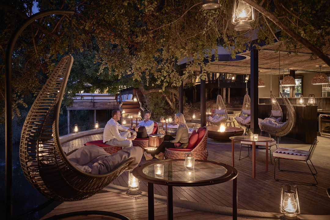 main entertainment areas and deck with guest seated for drinks at Royal Malewane Kruger National Park