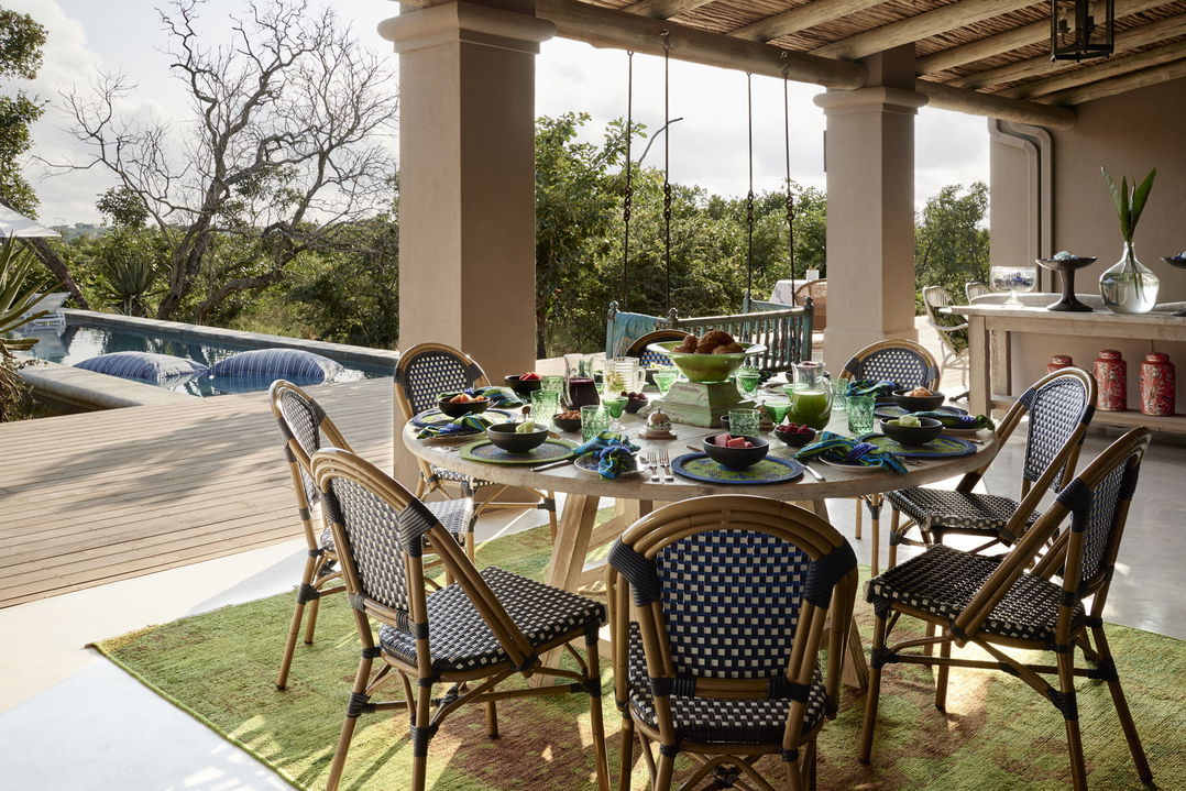 Royal Malewane Farmhouse Verandah with furniture and pool beyond