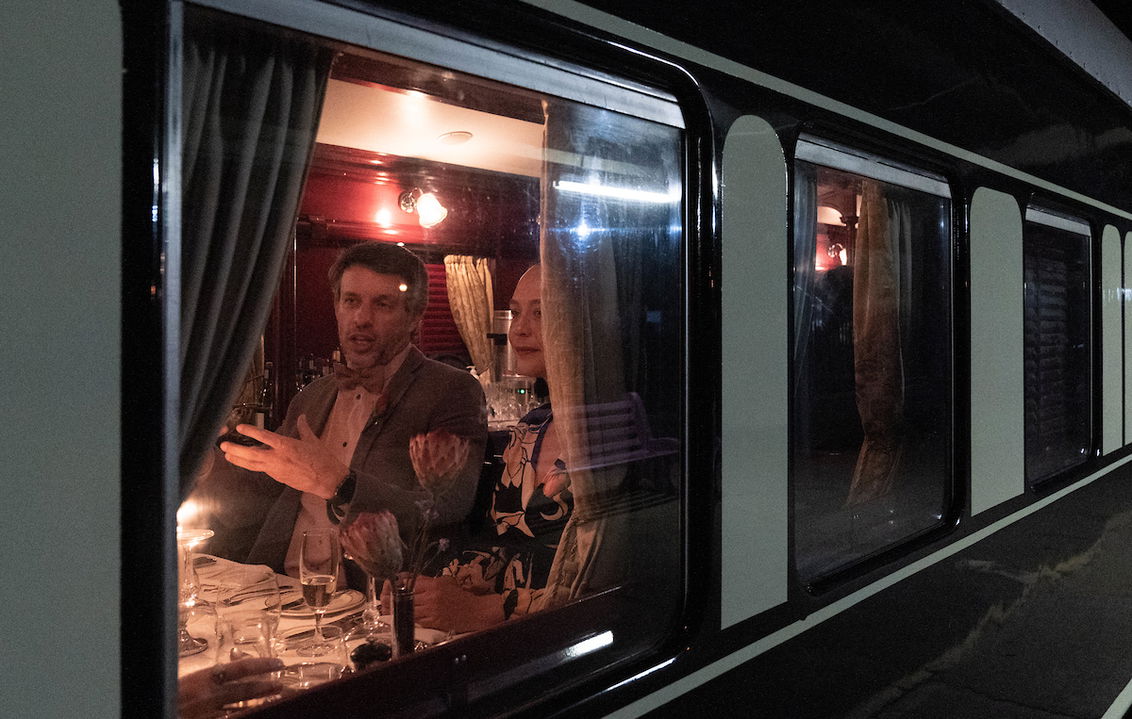 guest looking out of window of Rovos rail train