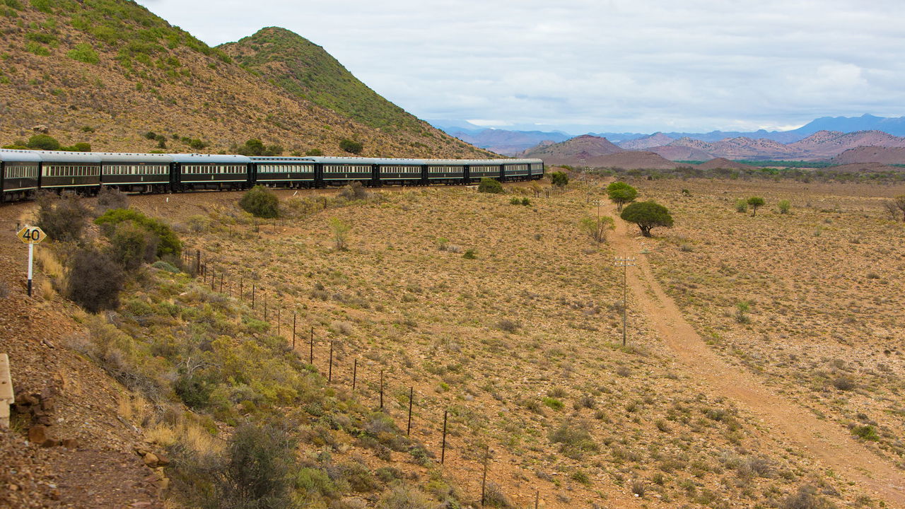 train traveling through the karoo in south Africa with Rovos Rail
