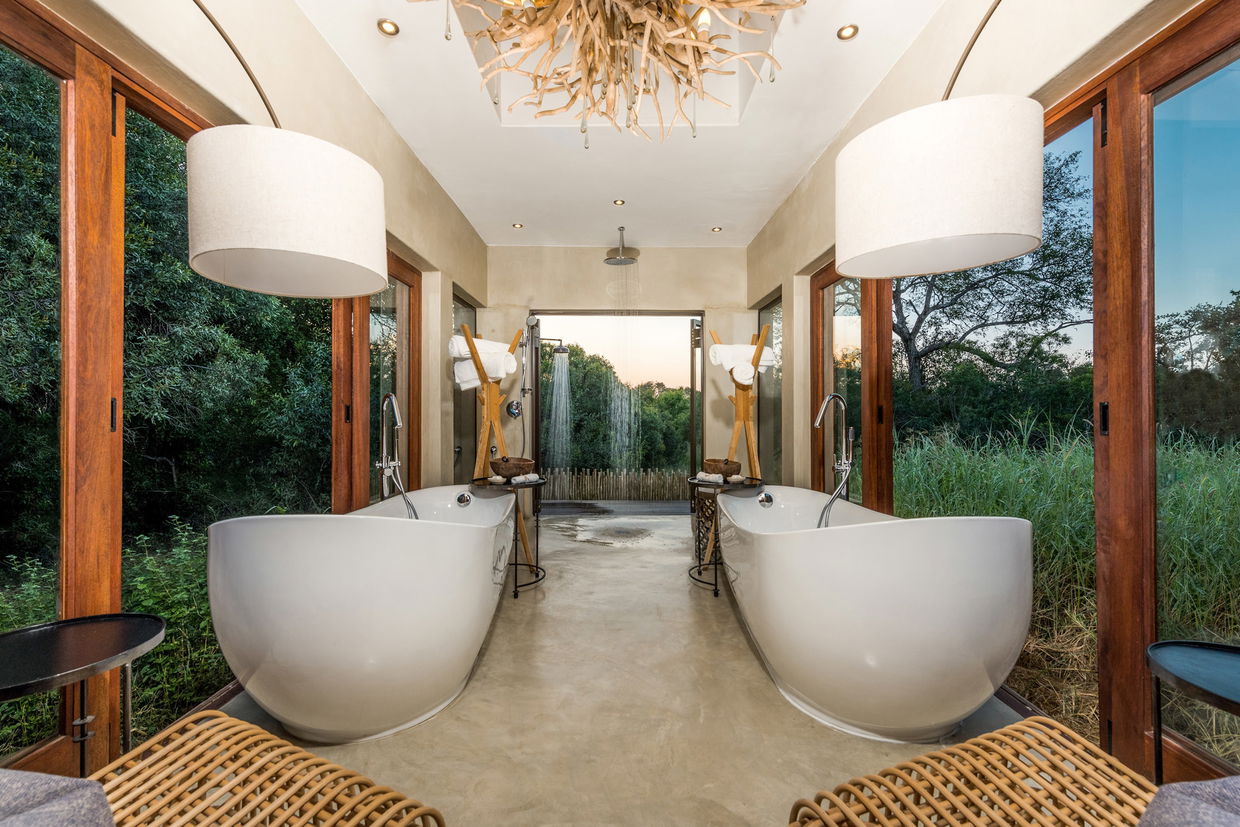 view of bathroom with twin tubs at sabi sabi bush lodge villa