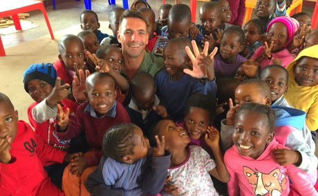 children at local scholl visited by guest during community outreach