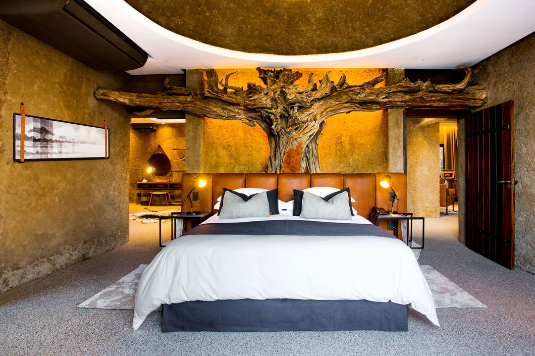 interior view of bedroom at night at amber villa sabi sabi