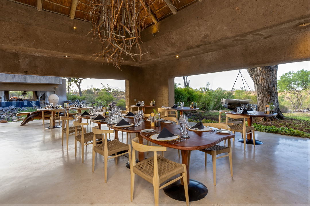dining area of sabi sabi earth lodge main lodge showing tables and chairs