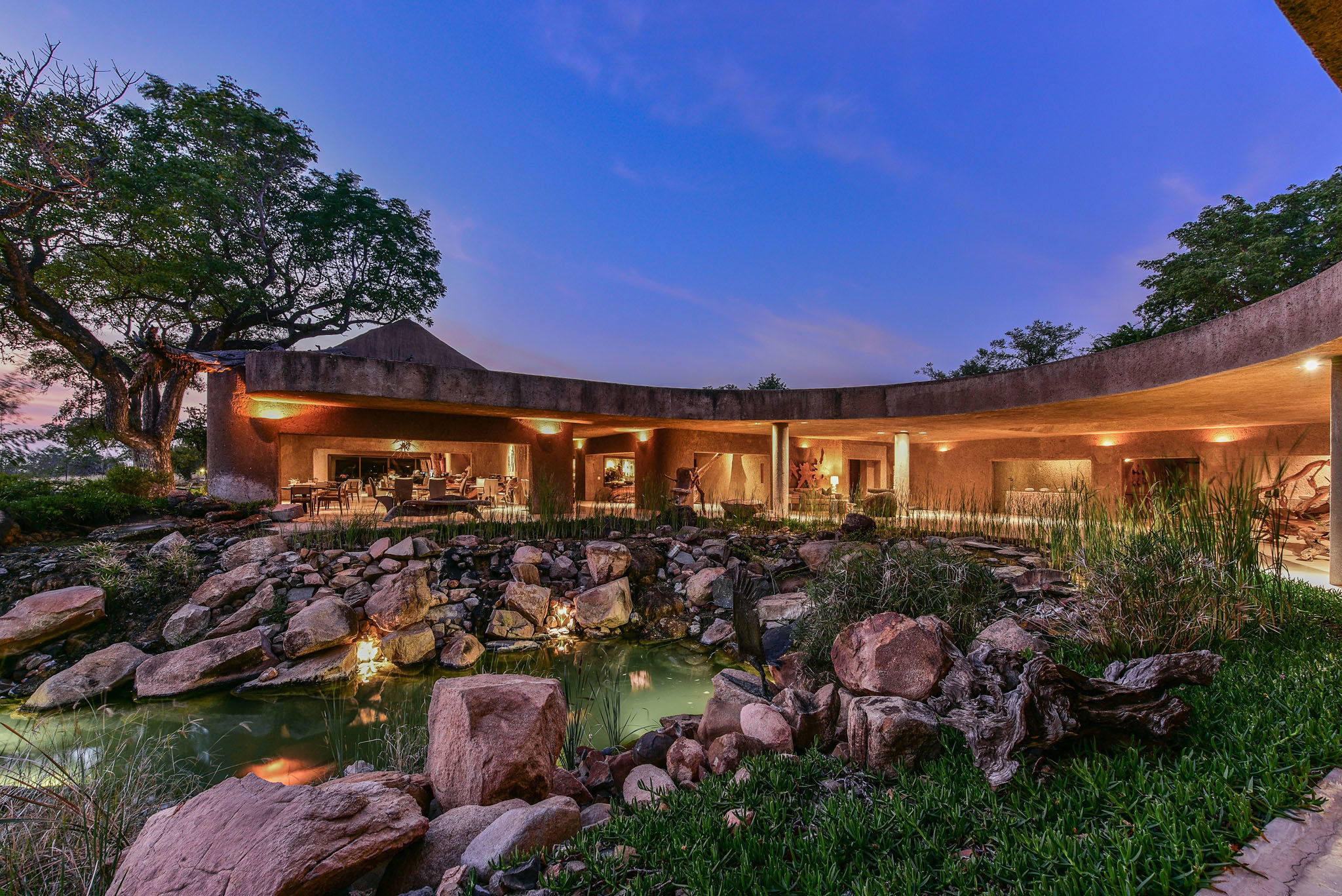 sunset view from outside of sabi sabi earth lodge