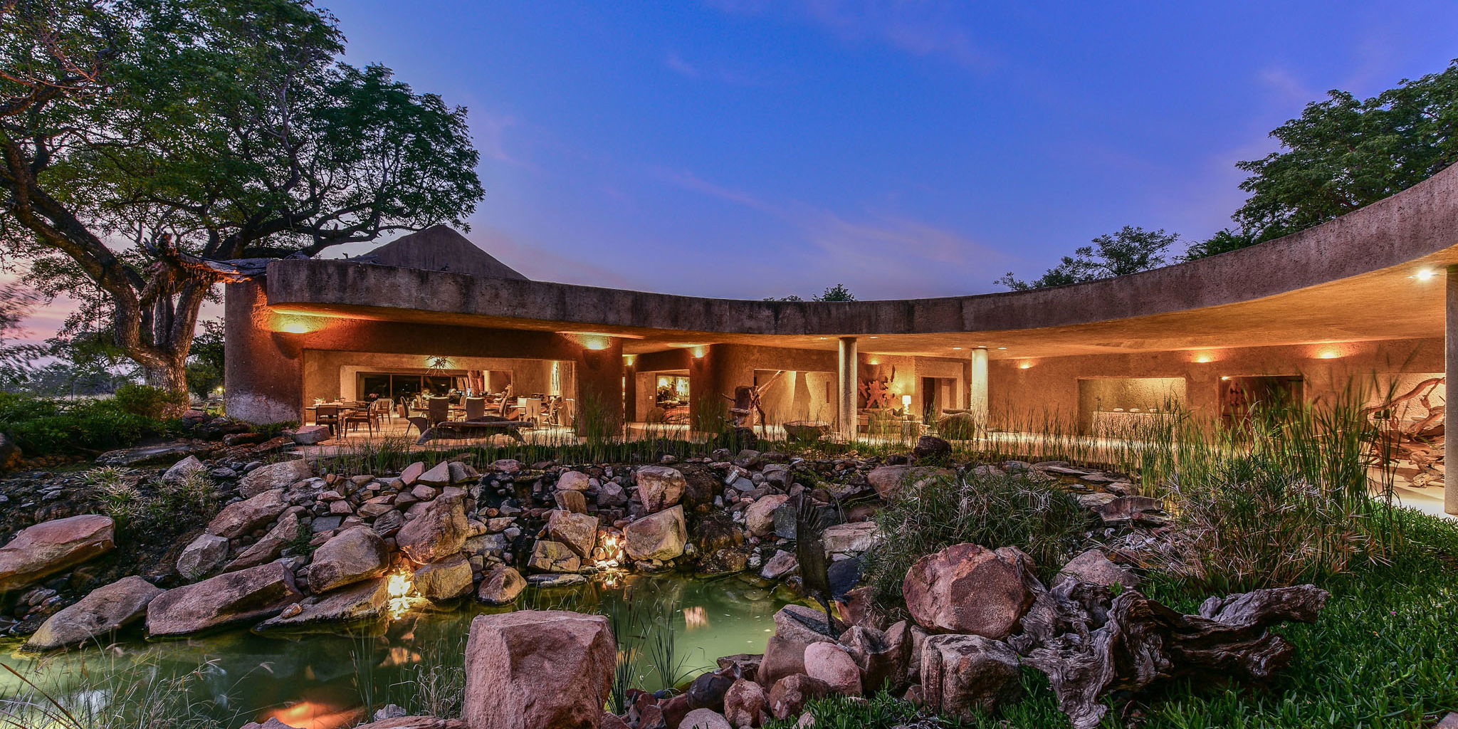 sunset view from outside of sabi sabi earth lodge