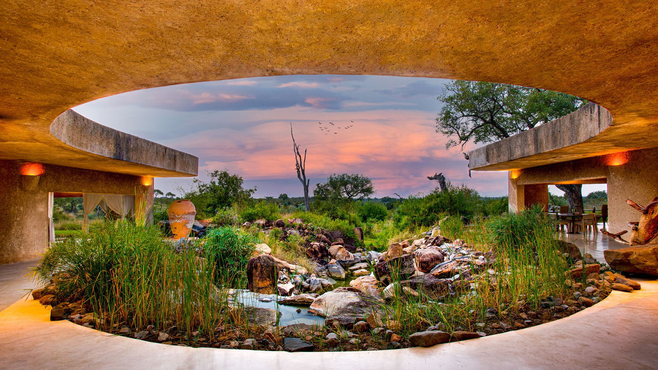 exterior evening view of earth lodge at sabi sabi game reserve
