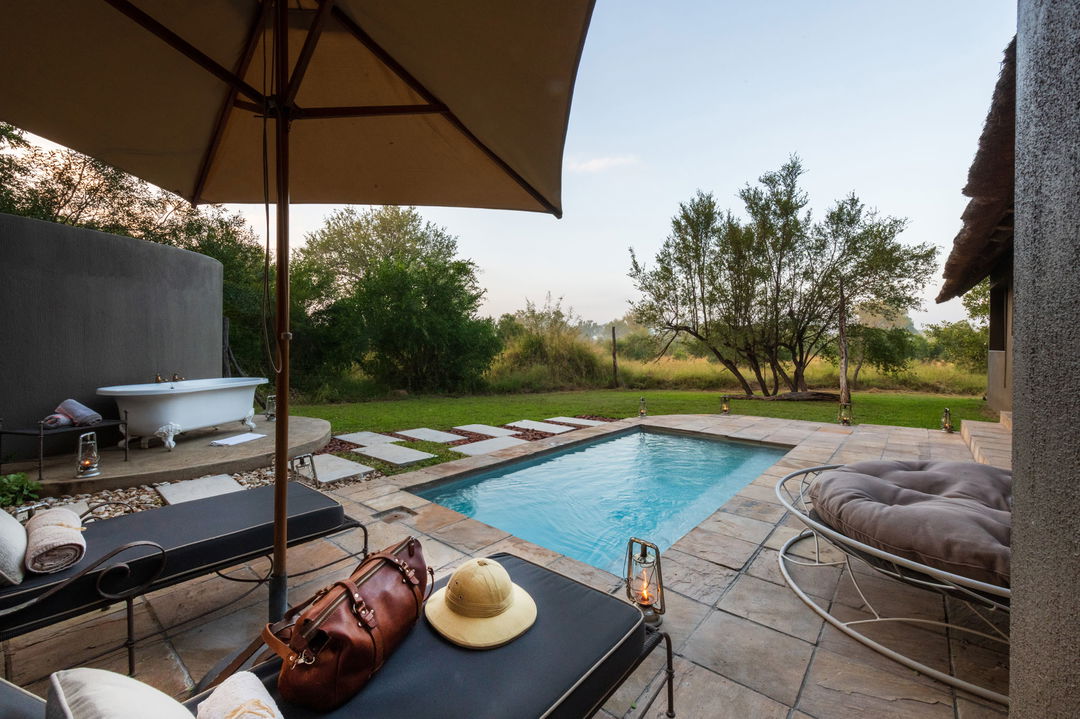 pool view from inside ivory presidential suite at sabi sabi selati camp