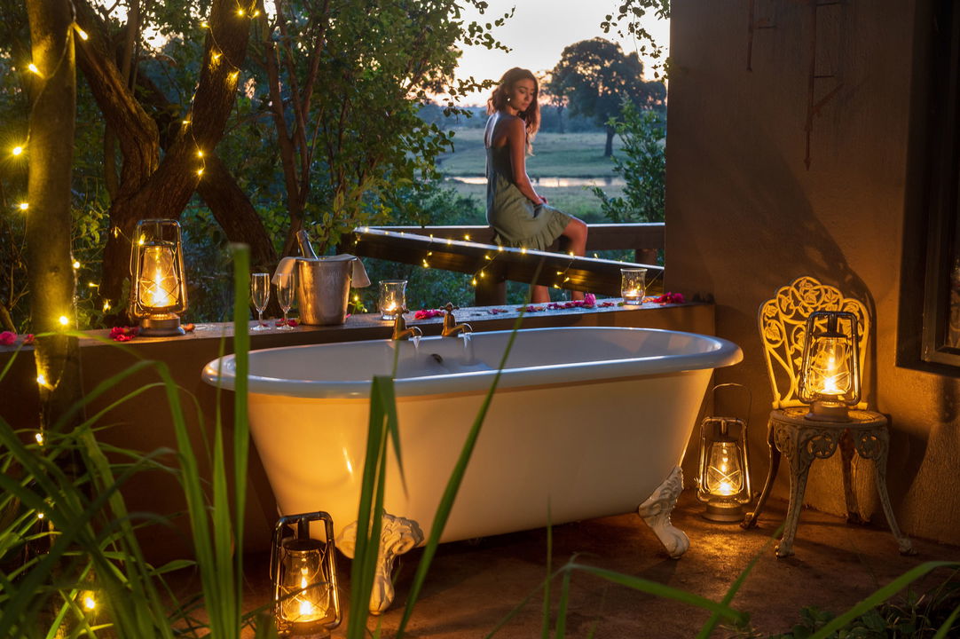 bathroom view with drawn bath of LM honeymoon suite at sabi sabi selati camp