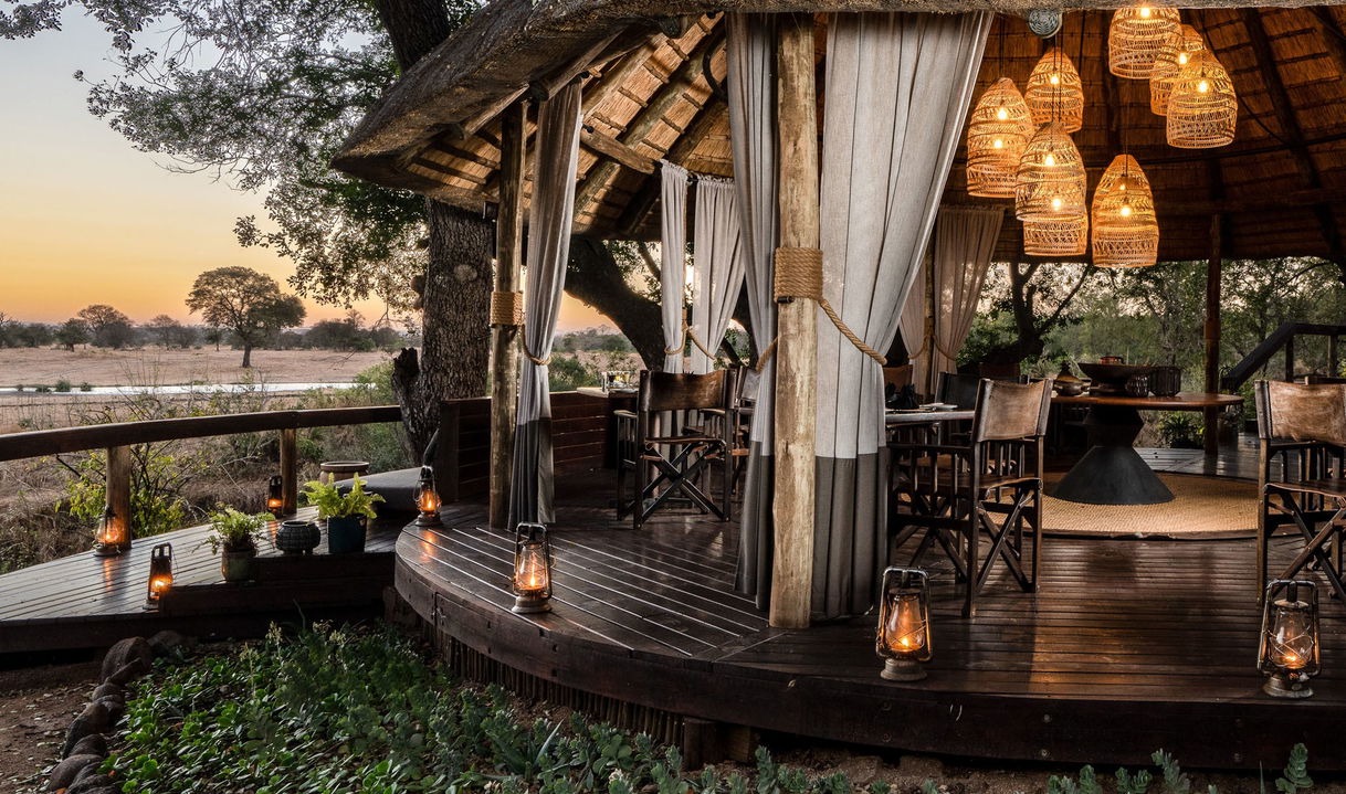 main deck of lodge at night by selati camp sabi sabi