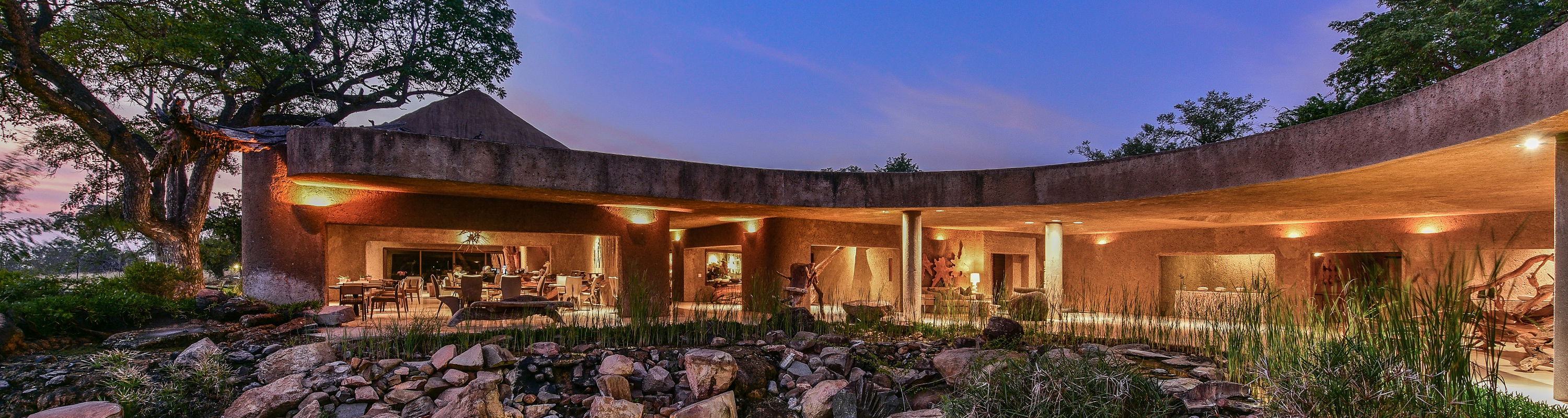 sunset view of the earth lodge at sabi sabi luxury safari lodges