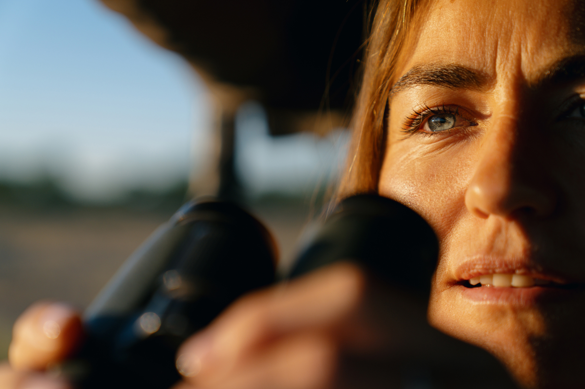 lady with binolculars on a biding safari