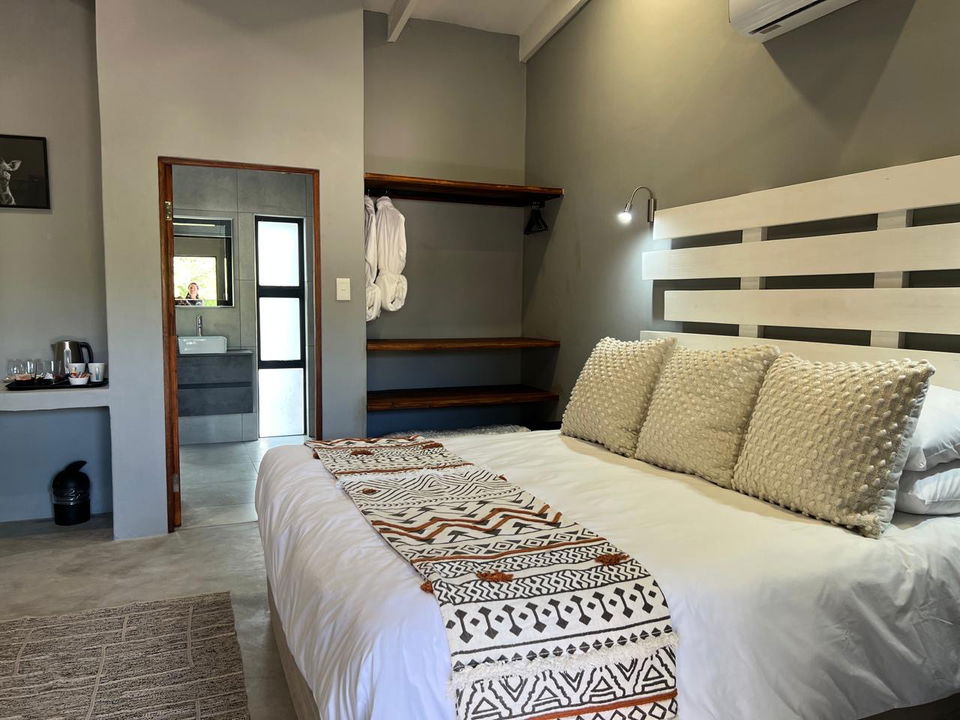 interior of luxury room in white furniture at secrets VIP safari lodge Komatipoort