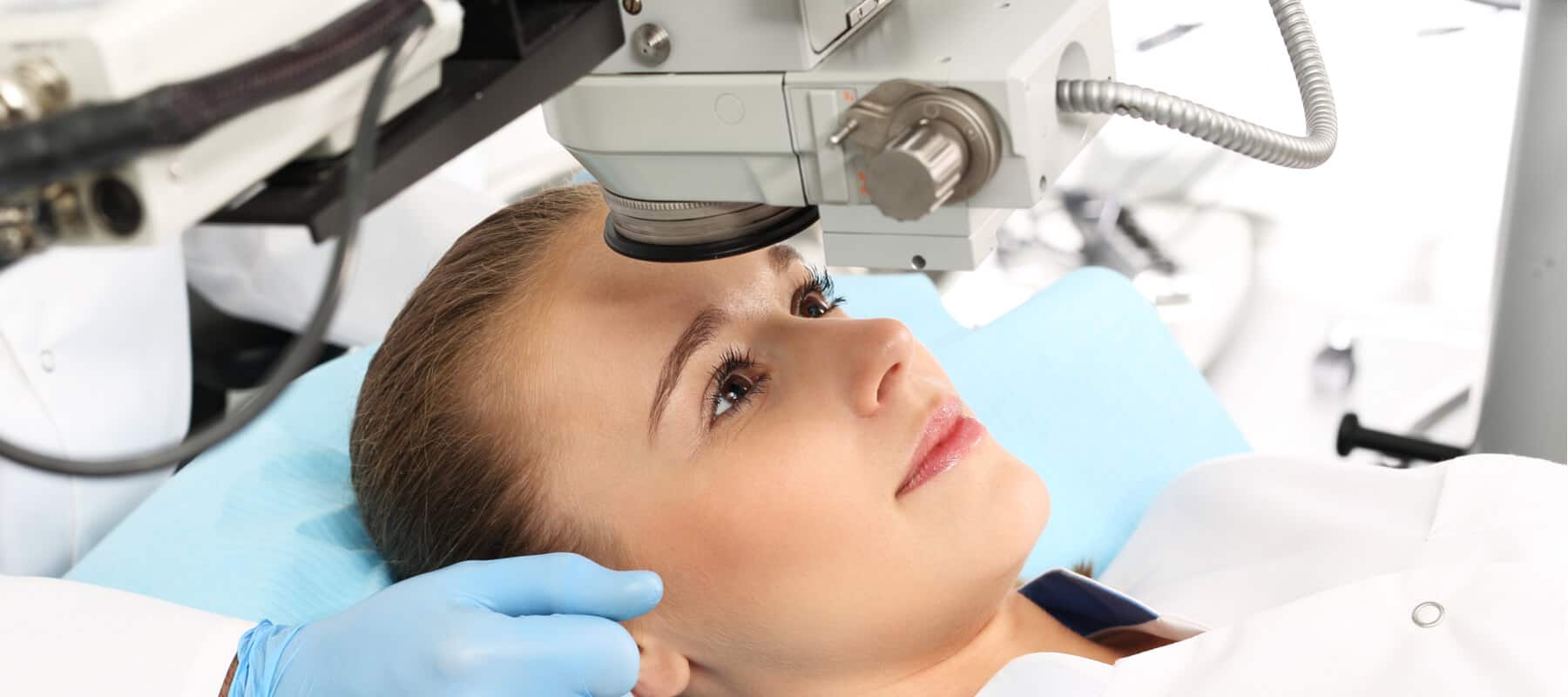 lady looking at equipment in theatre to undergo eye surgery