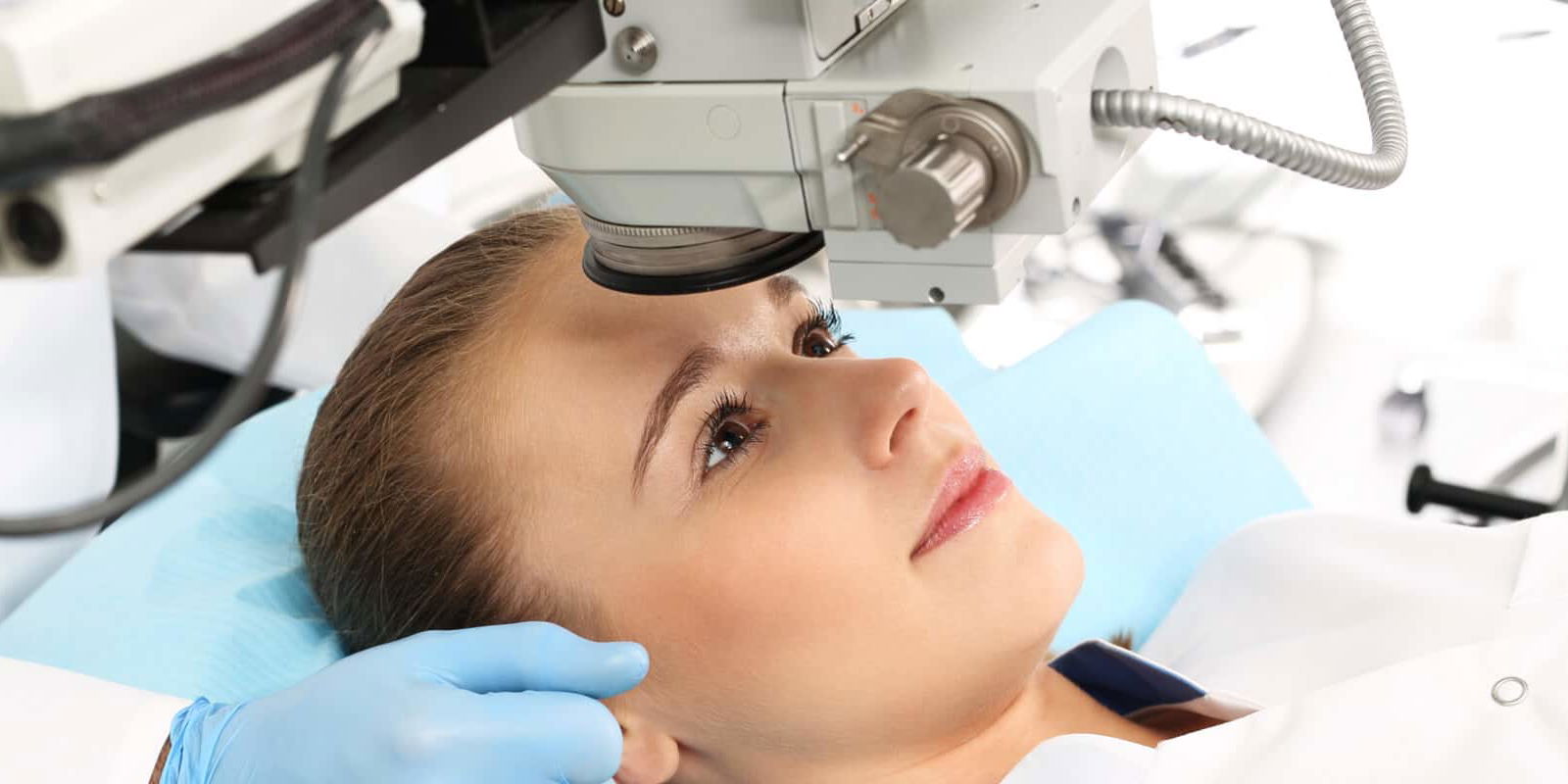 lady looking at equipment in theatre to undergo eye surgery