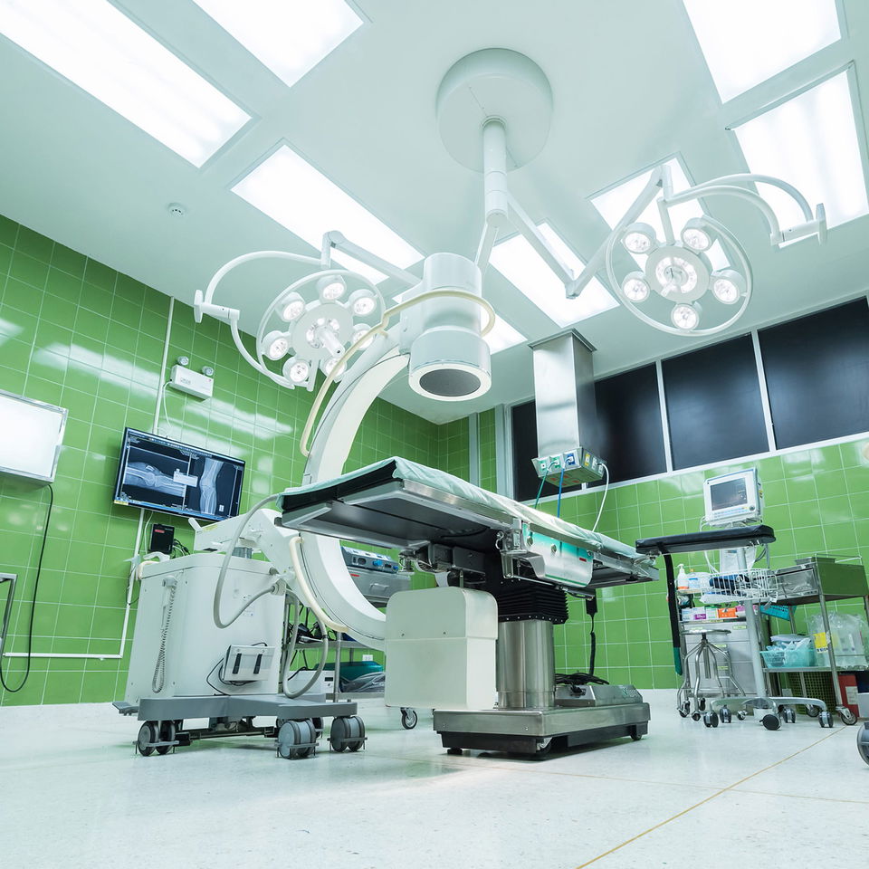 inside of hospital theatre with bed and medical equipment