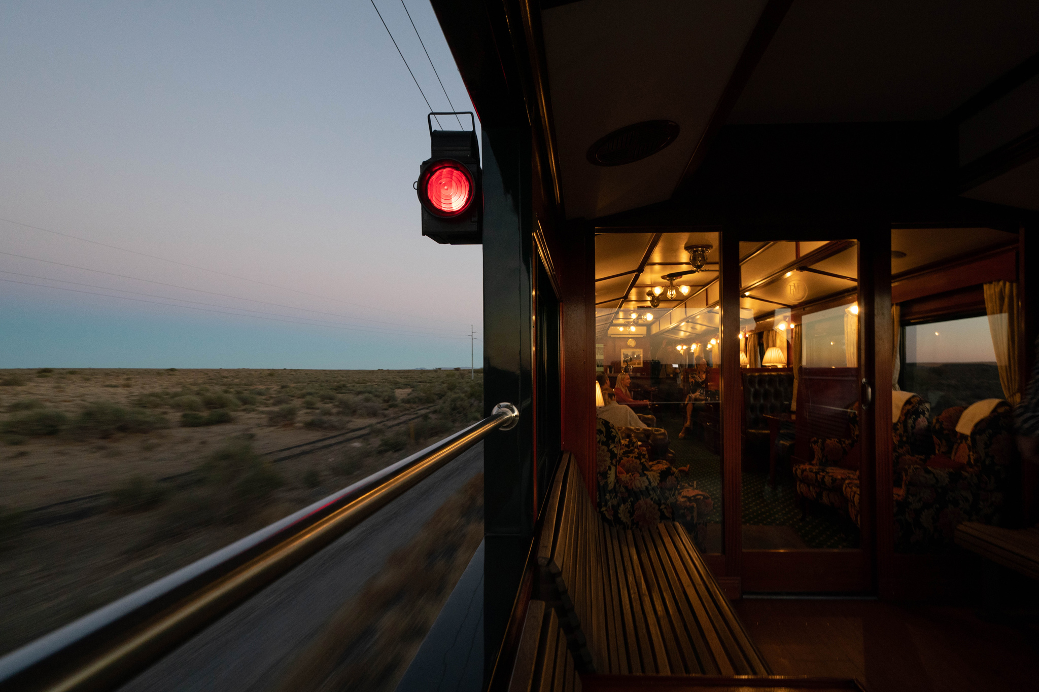 side of train with lantern viewed from rear cart at Rovos rail luxury train safaris