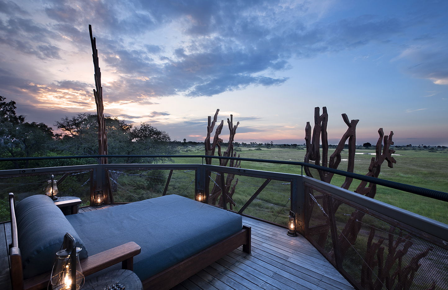 deck overlooking savanna and waters at  Xigera lodge Okavango delta Botswana