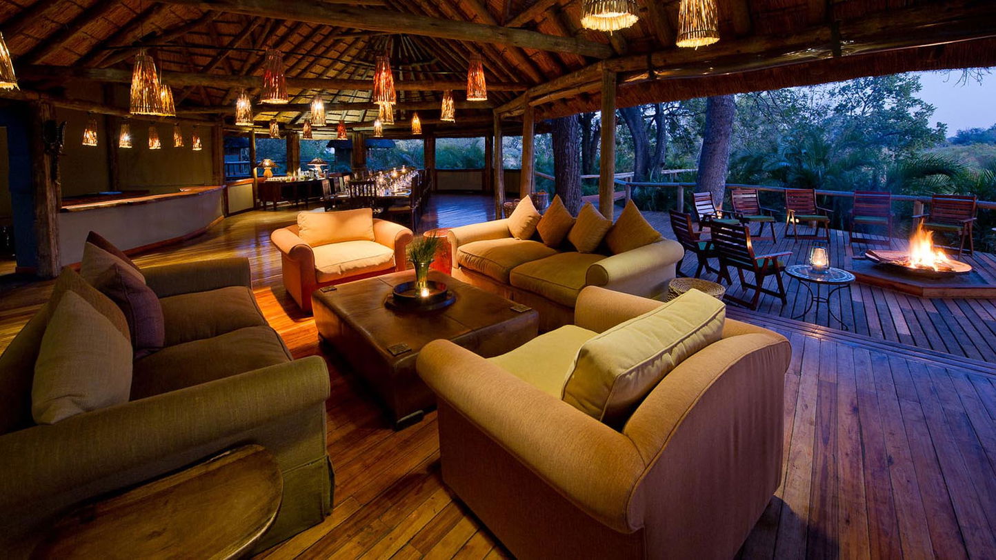 loungers in man area of  Xigera lodge Okavango delta Botswana