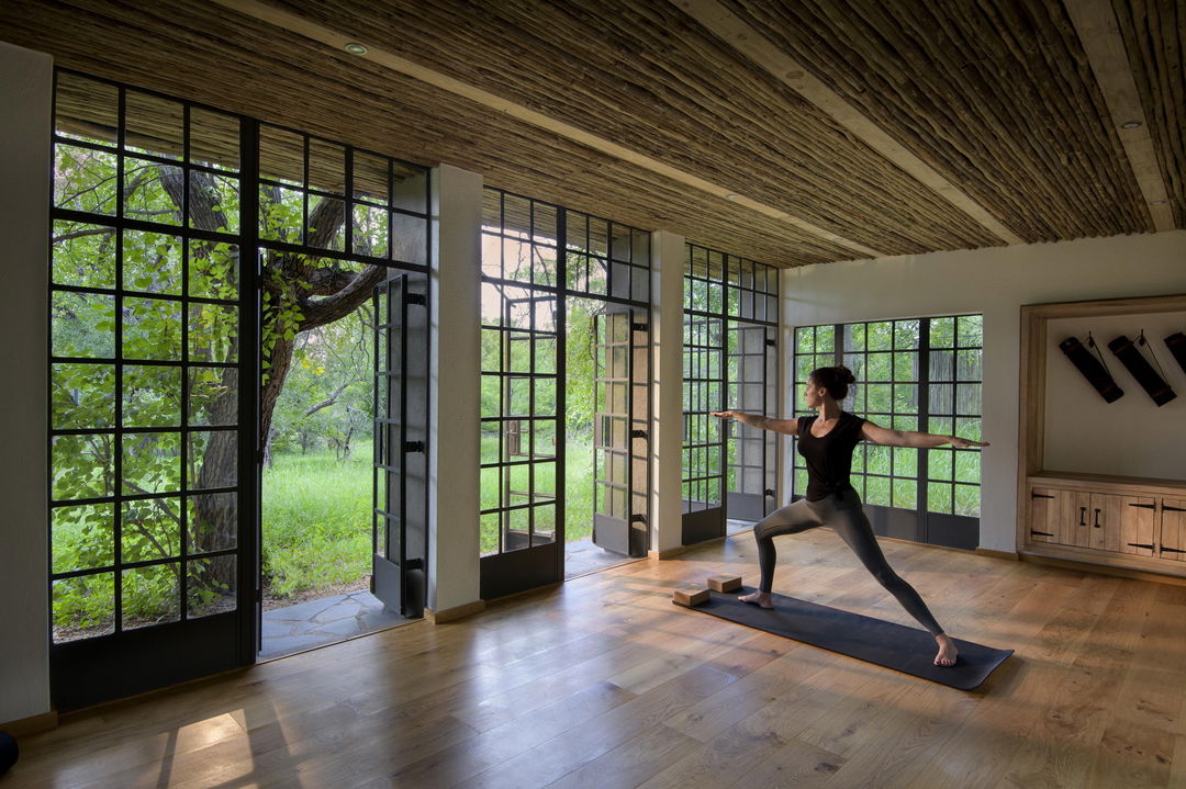 lady working out in fitness studio at singita castleton