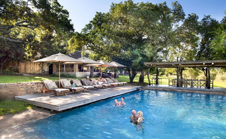 guests in pool of singita castleton lodge guests in pool of singita castleton lodge