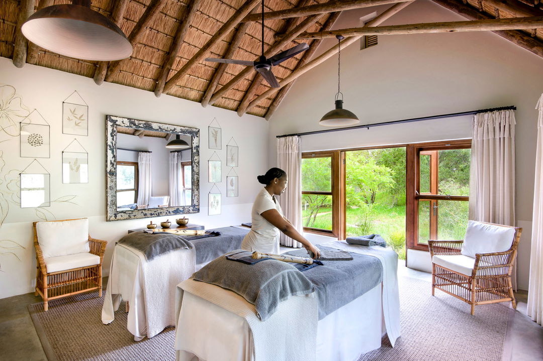lady in treatment room of spa at singita castleton lodge